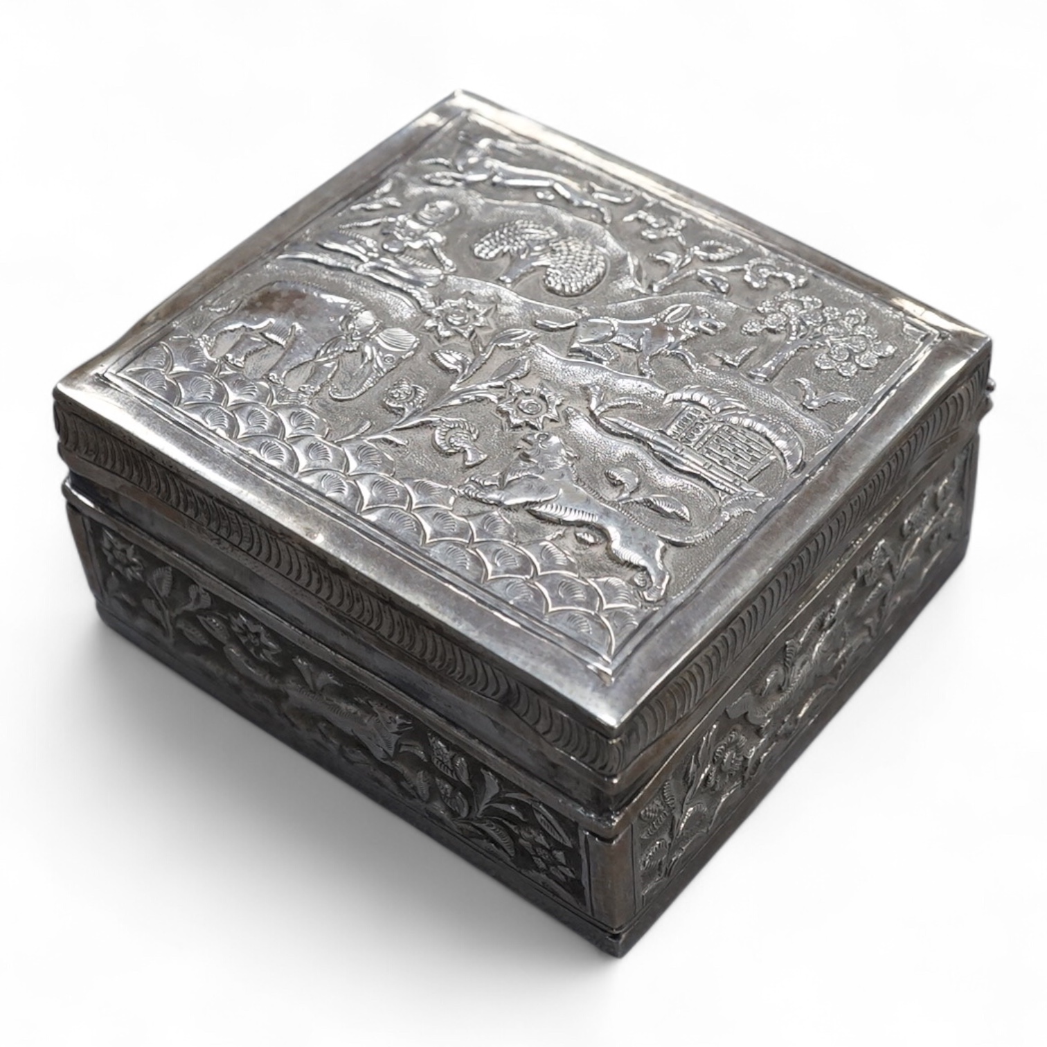 An Indian small square white metal cigarette box, embossed with animals and figures, width 78mm, 4.4oz.